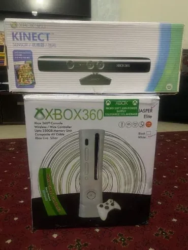 xbox 360 with kinect sensor and 2 controllers