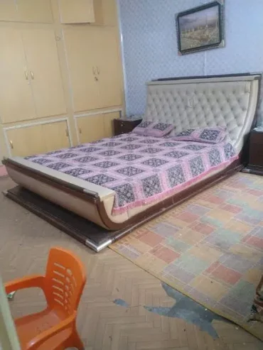 king size bed with side table and dressing