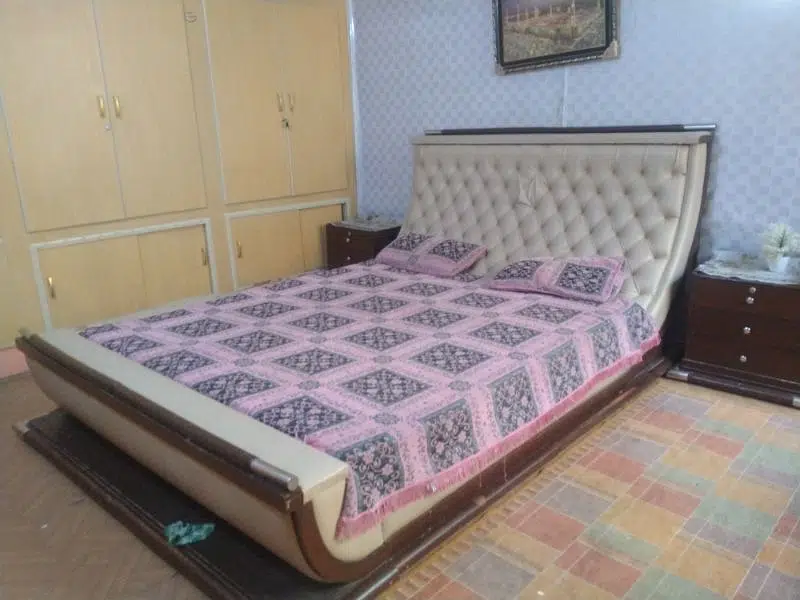 king size bed with side table and dressing