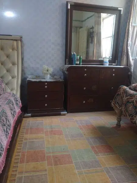 king size bed with side table and dressing