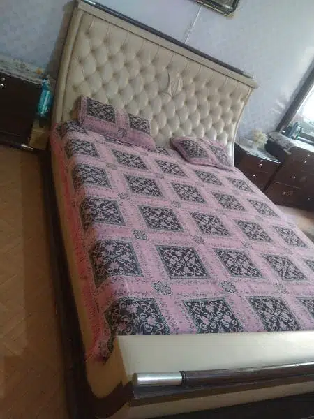 king size bed with side table and dressing