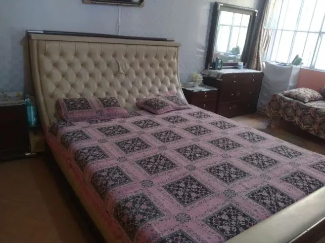 king size bed with side table and dressing
