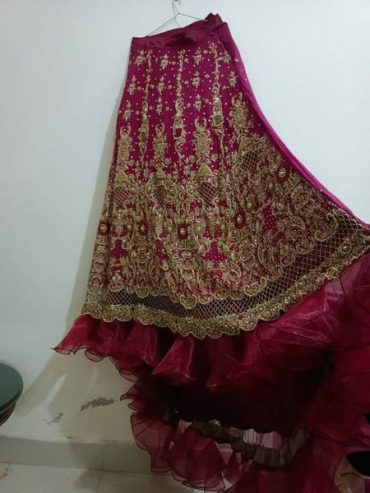 bridal dress tail lehnga with contrast dopata