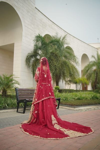 bridal dress with long tailed lehnga